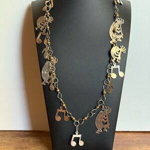 Vintage Silver Tone and Brass Kokopelli and Musical Note Charm Necklace